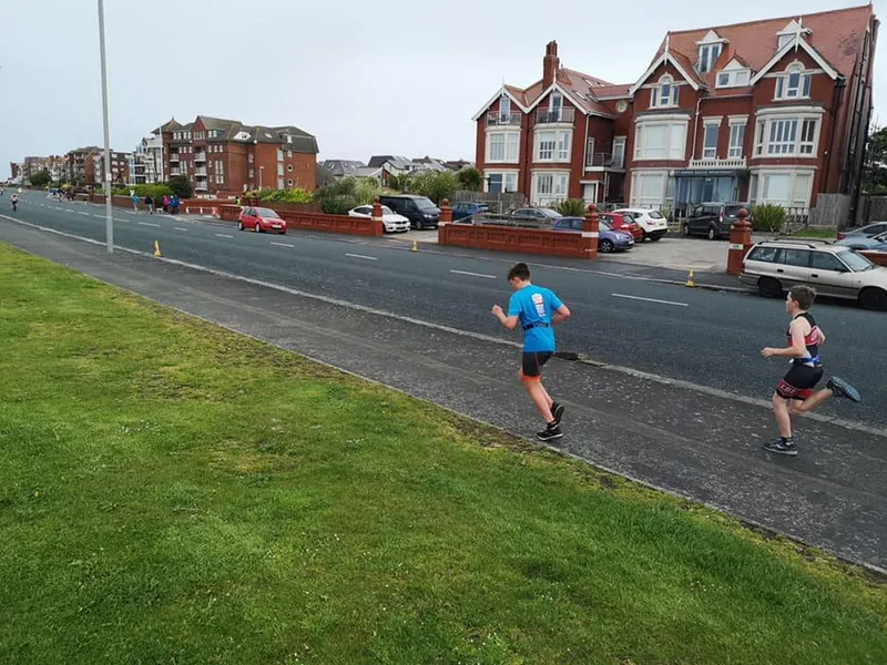 Juniors running along Preston seafront